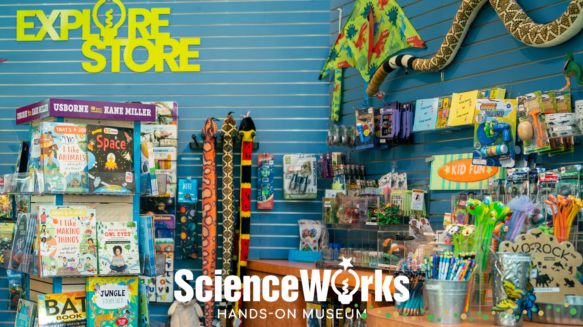 a photograph of the explore store at scienceworks featuring books, stuffed animals, and other toys