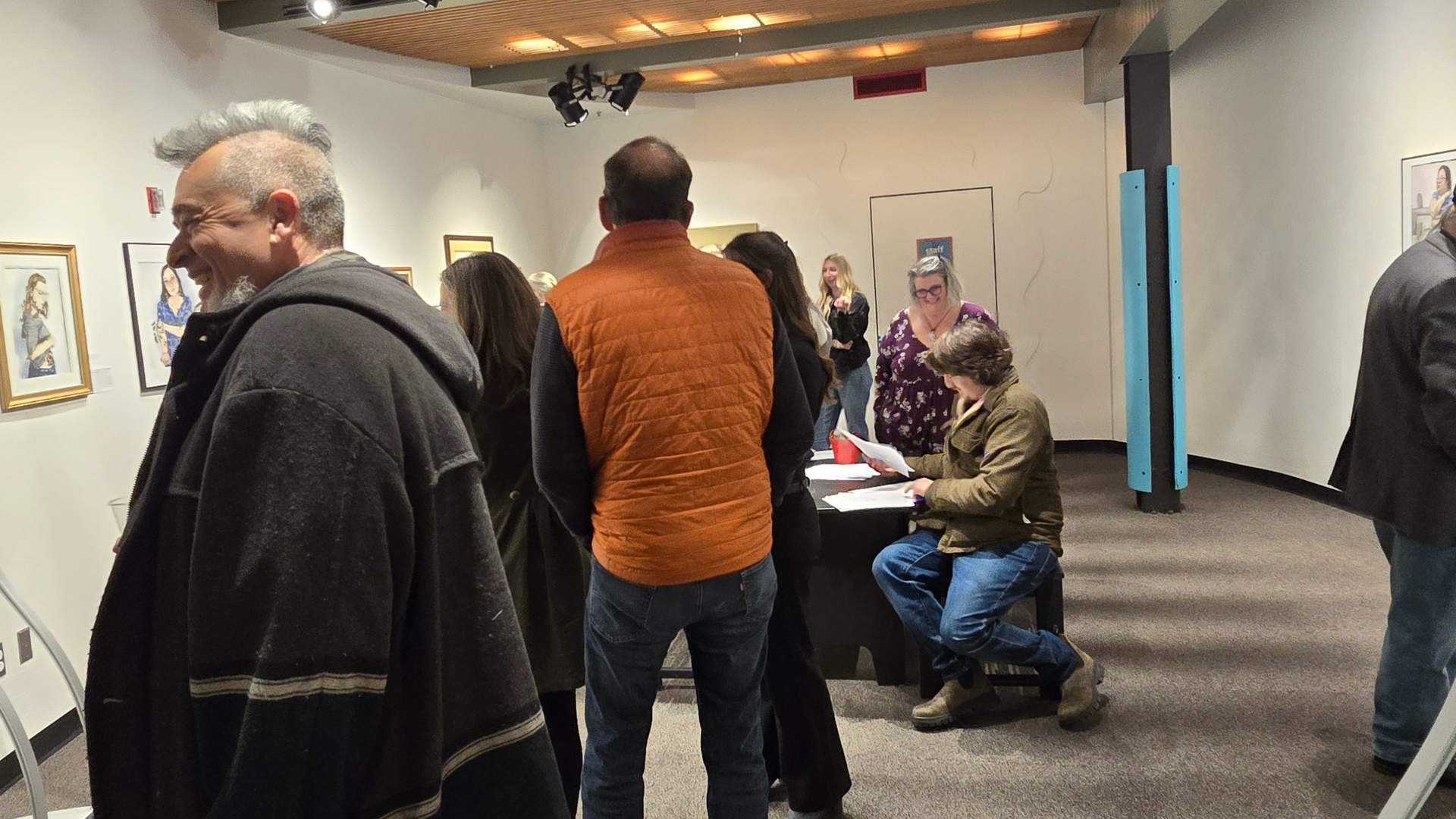 guests mingle in the Art in STEAM Gallery at ScienceWorks taking in the art and participating in a hands-on activity.