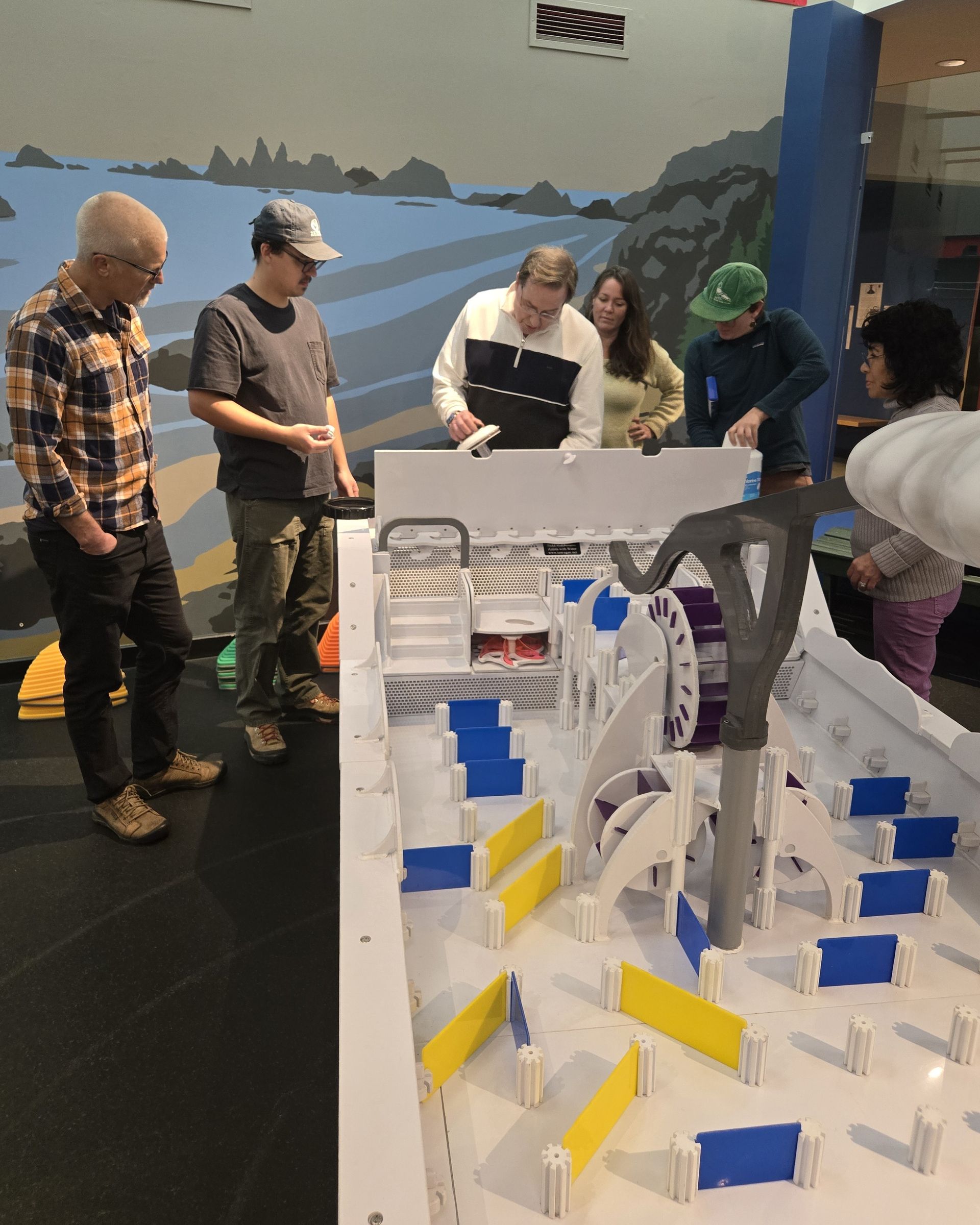 ScienceWorks staff being trained on the water table setup from the fabrication team