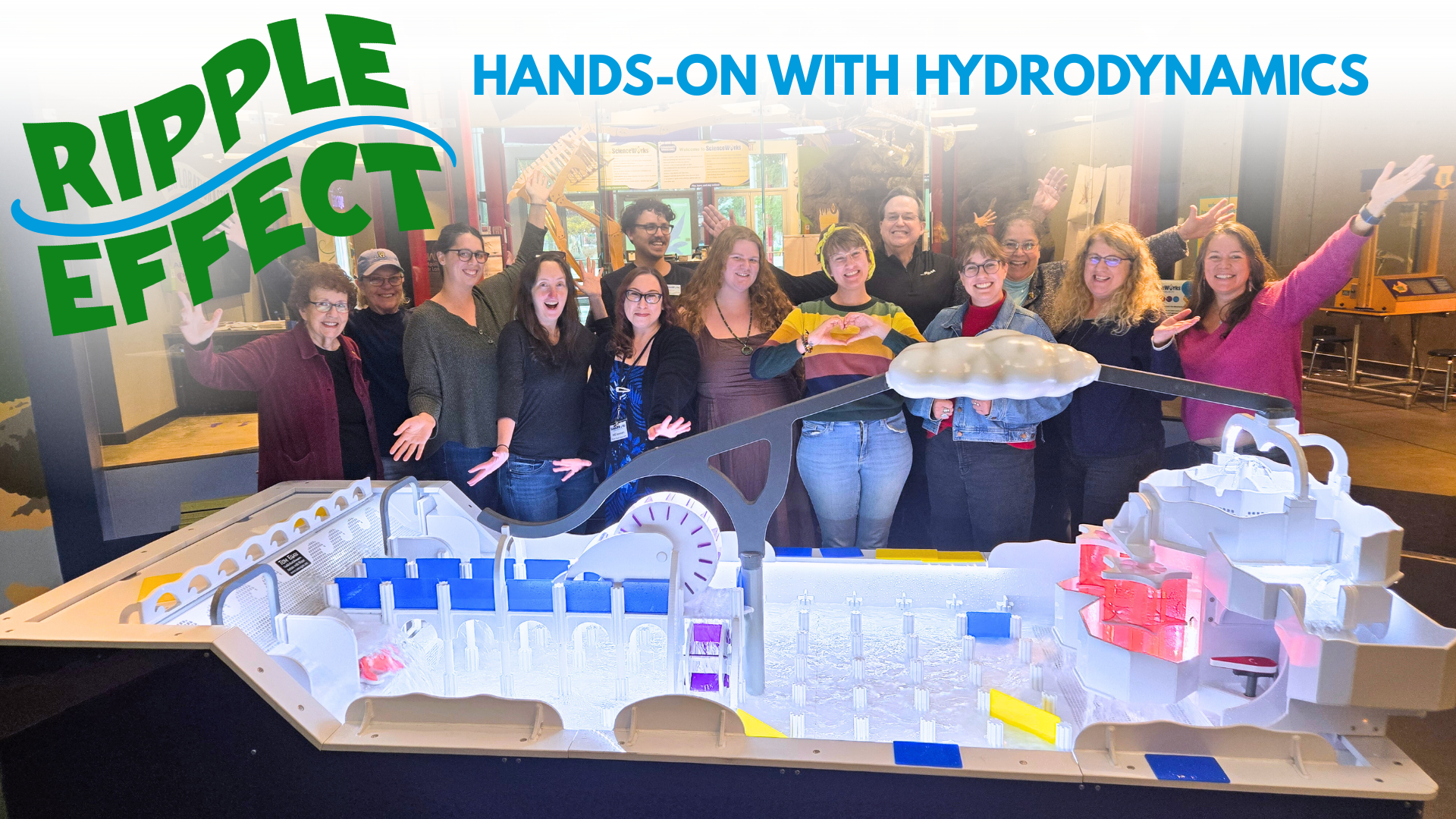 ScienceWorks Staff pose with a hands-on water table exhibit; 