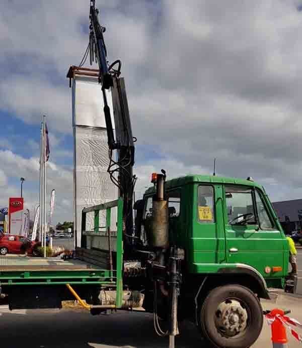 Crane Lift Bucket to Roof — Bell's Carrying & Crane Hire Service Pty Ltd in Bungalow, QLD
