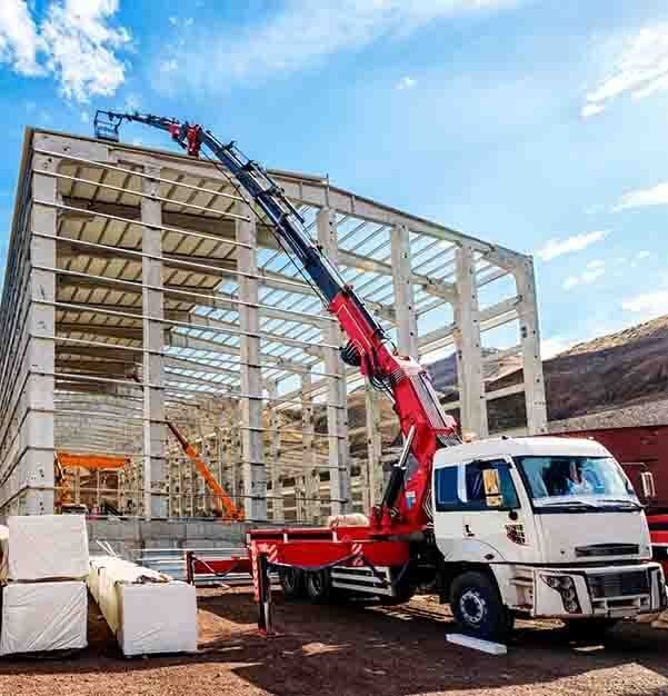 Crane Lift Bucket to Roof — Bell's Carrying & Crane Hire Service Pty Ltd in Bungalow, QLD