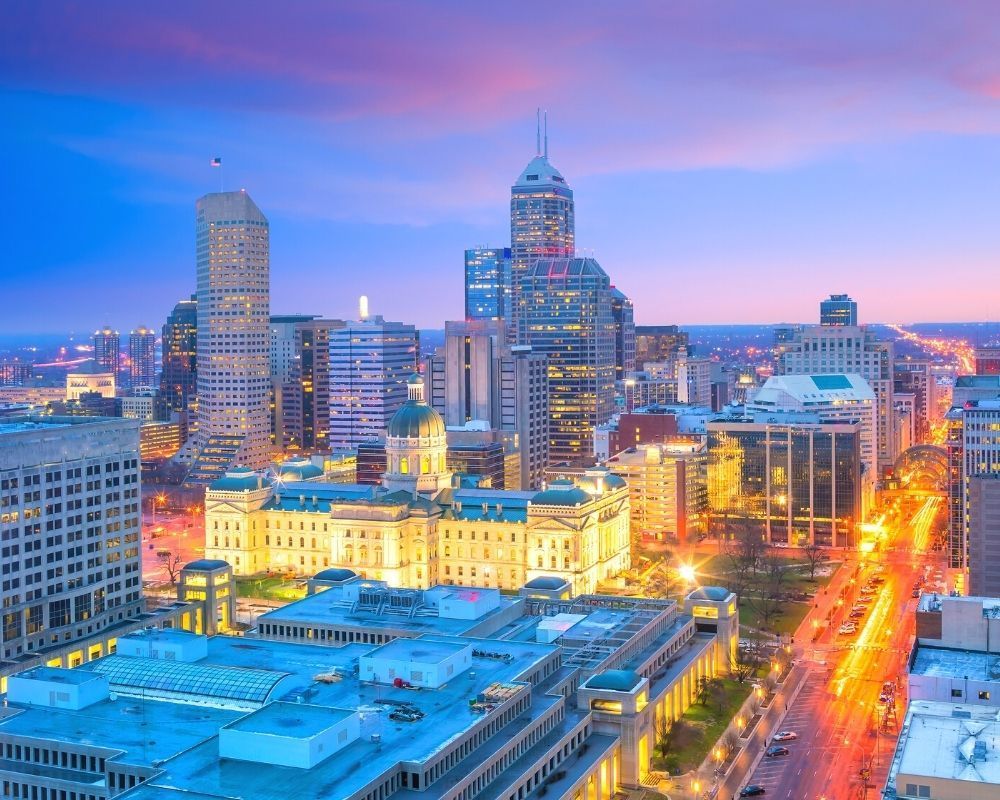 Indianapolis city center at dusk, How much does it cost to live in Indianapolis Indianapolis city center at dusk, How much does it cost to live in Indianapolis