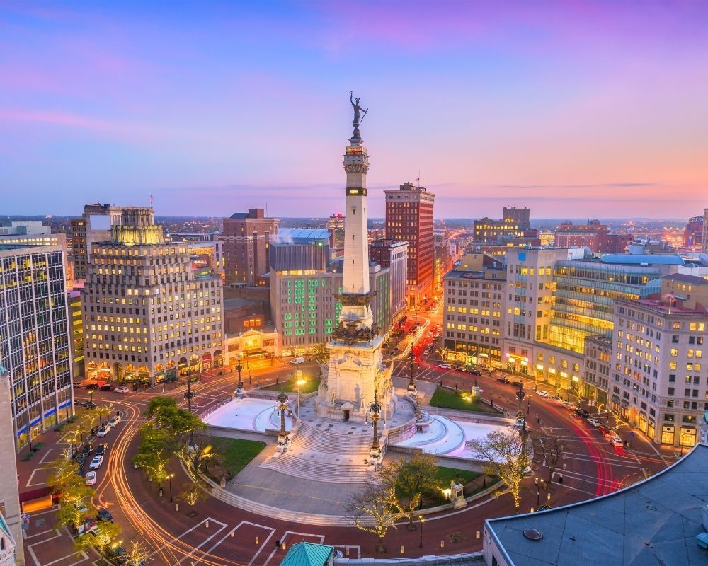 Indianapolis monument with traffic below, How much does it cost to live in Indianapolis Indianapolis monument with traffic below, How much does it cost to live in Indianapolis