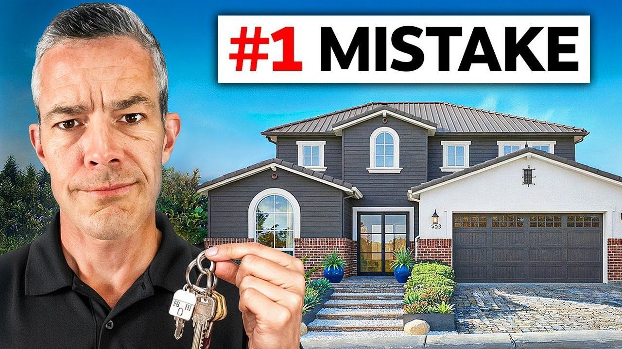 Man holding keys in front of house; title 
