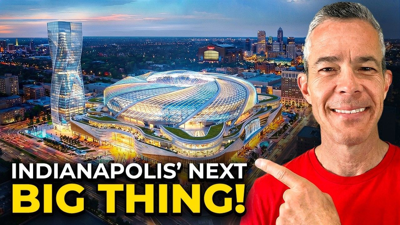 A man in a red shirt points to a rendering of a modern stadium and skyscraper complex in Indianapolis under text.