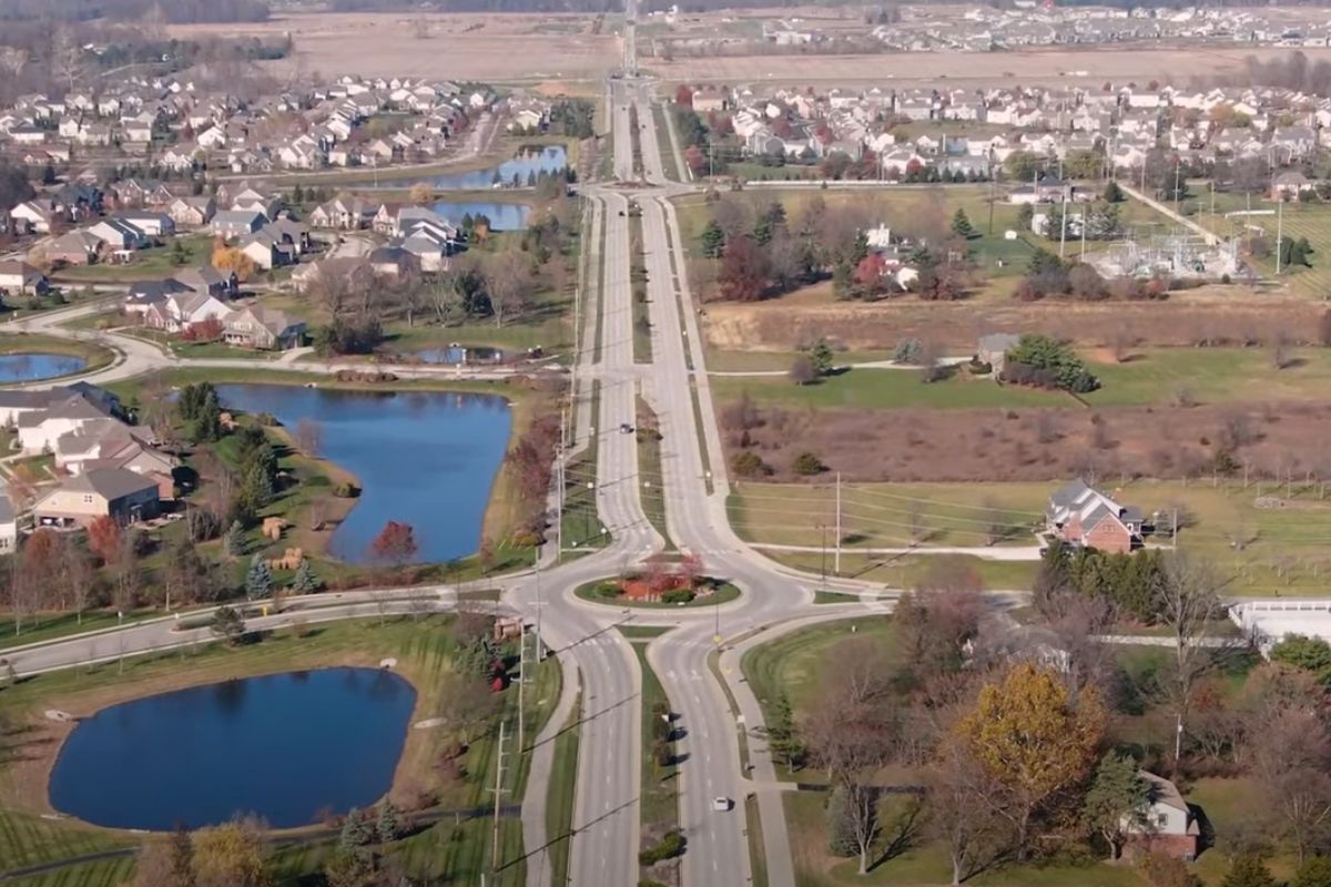aerial view of roundabout in Carmel, How to buy a home in Carmel IN if you cant afford it Westfield IN neighborhood, How far north is too far for Indianapolis