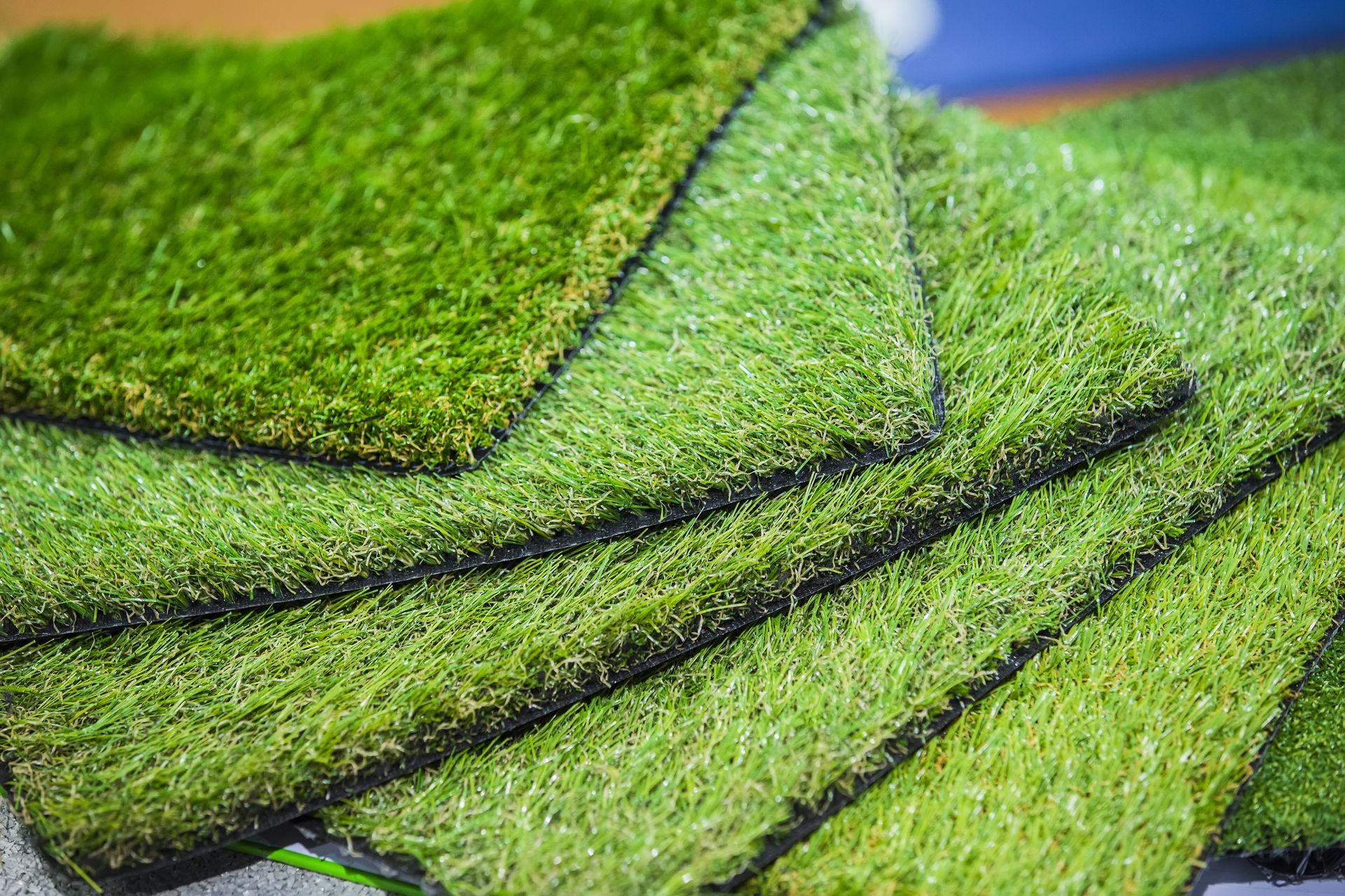 Samples of artificial turf in varying shades of green.