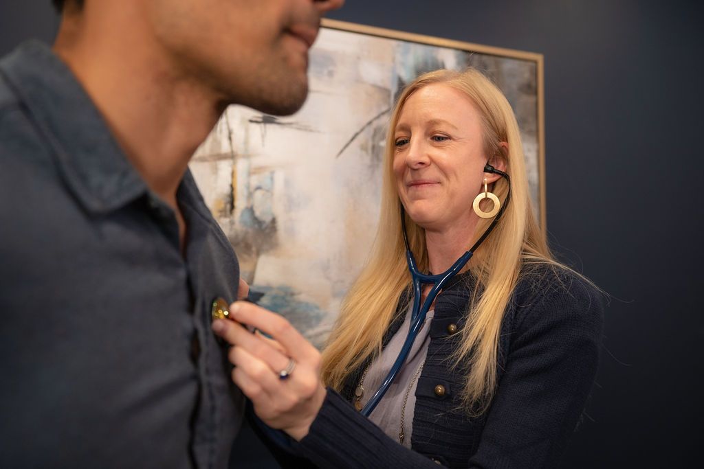 Cora Mattie using a medical device during a consultation