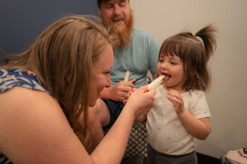 Balanced Healthcare staff conducting physical examination on a child