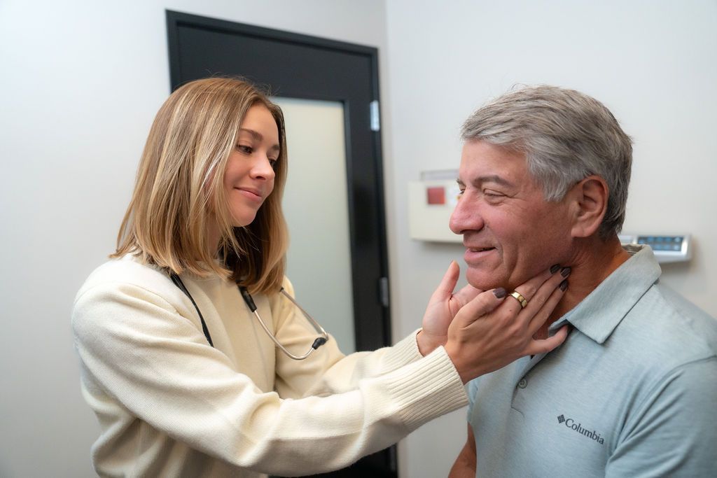 Balanced Healthcare provider physically examining a male patient