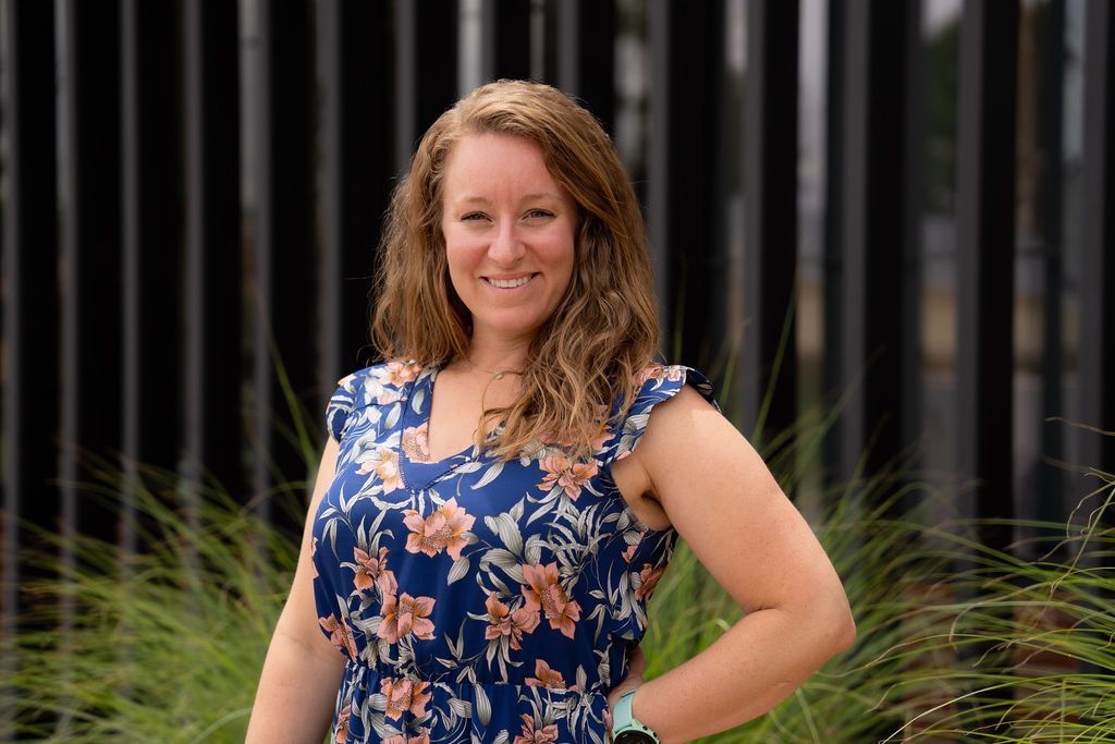 Julie Cookish standing outside in a floral top