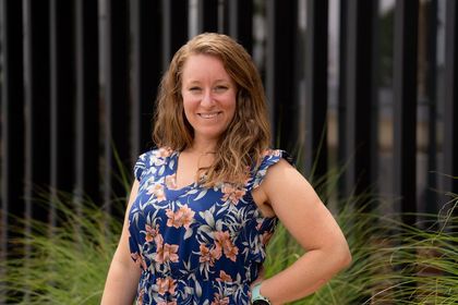 Julie Cookish standing outside in a floral top