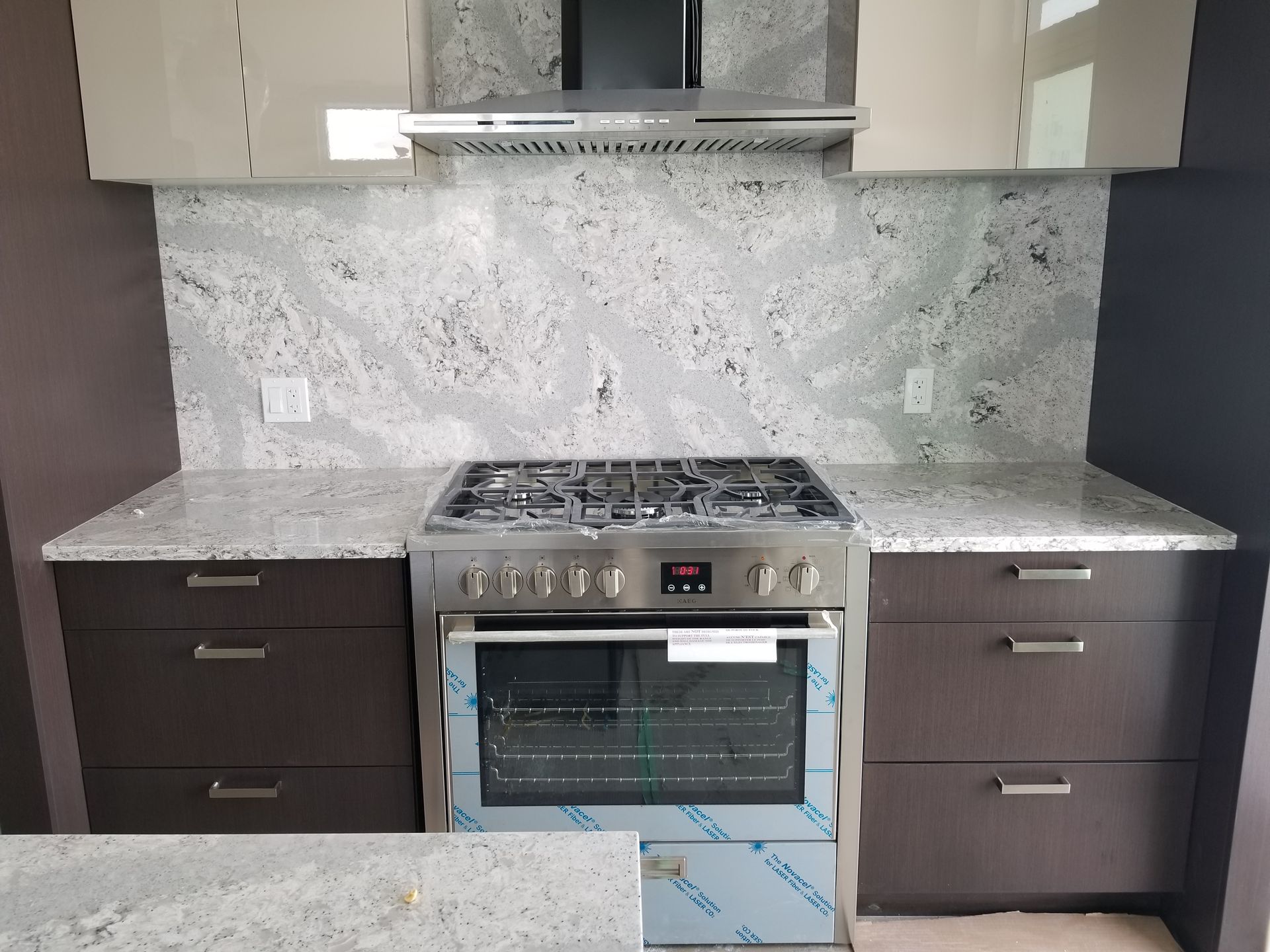 A kitchen with stainless steel appliances and granite counter tops