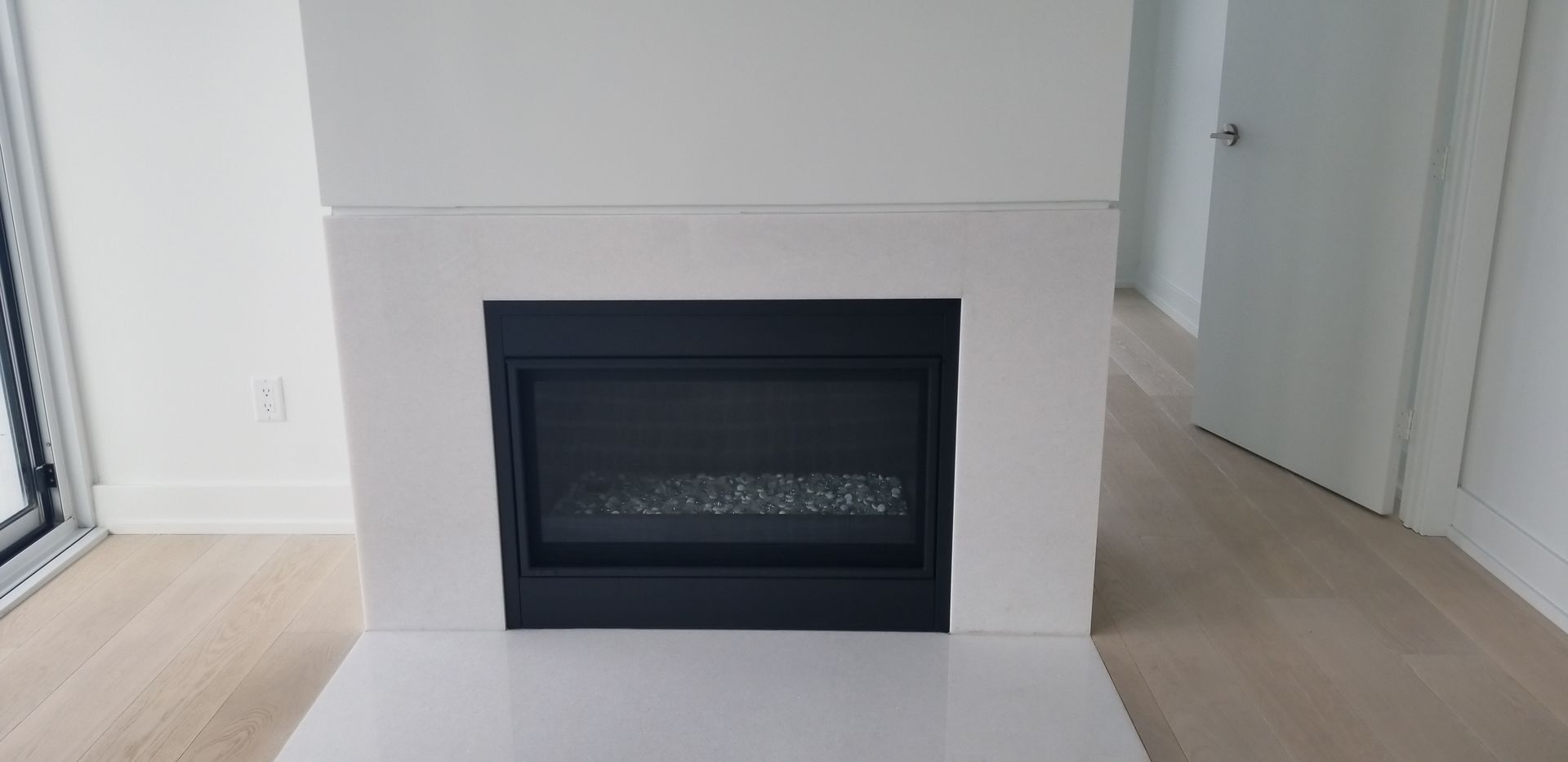 There is a fireplace in the middle of the room.