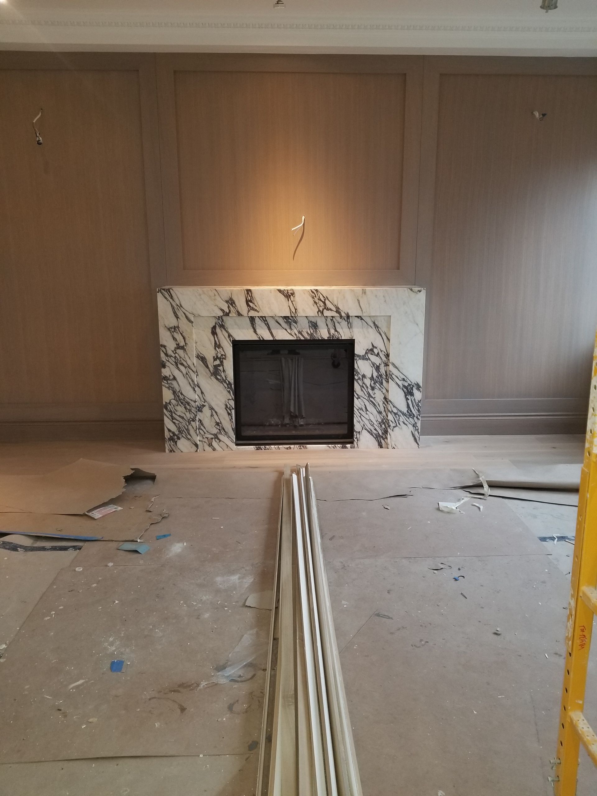 There is a fireplace in the middle of the room.