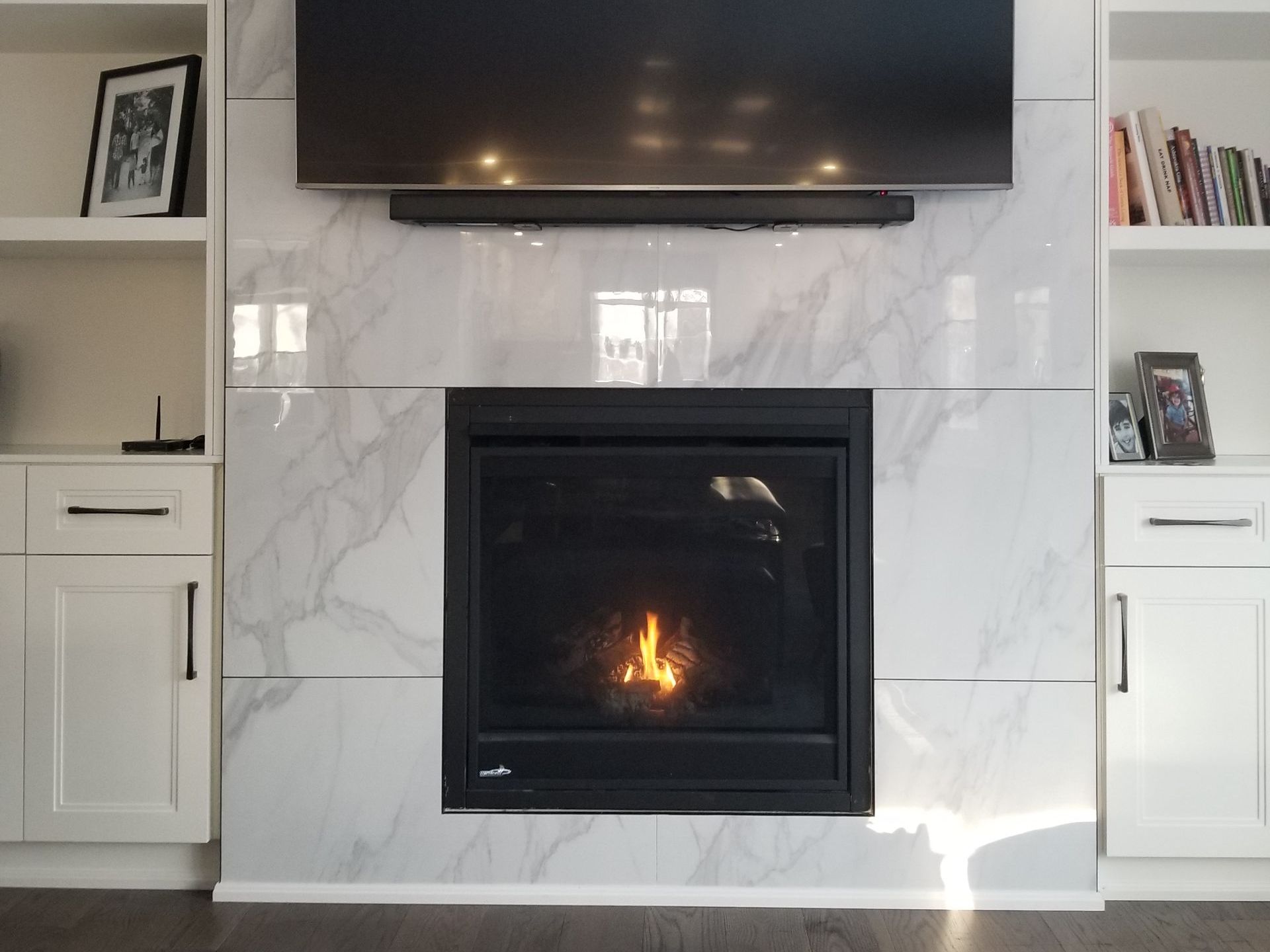 a fireplace with a flat screen tv above it