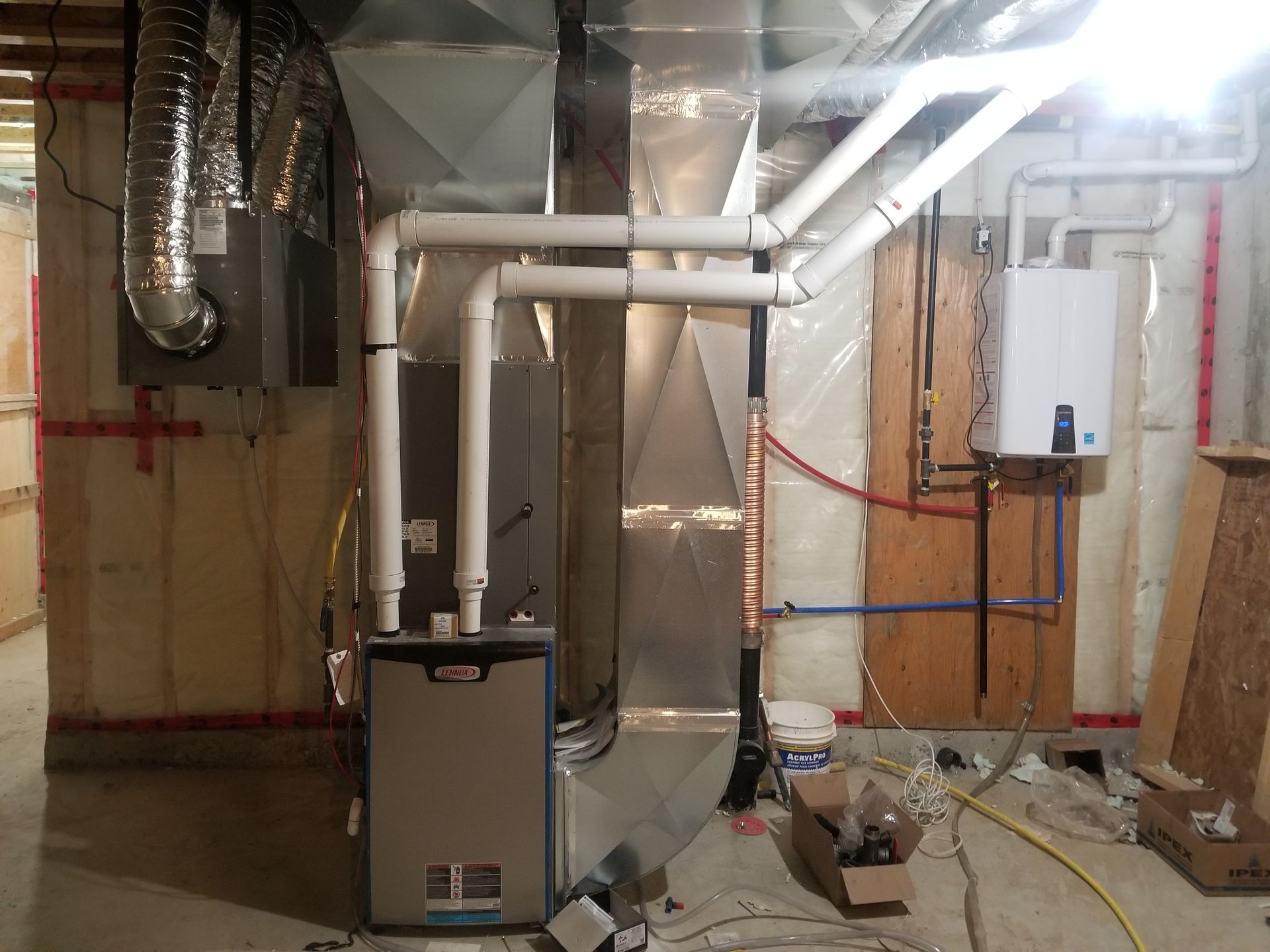 A room with a furnace and pipes in it