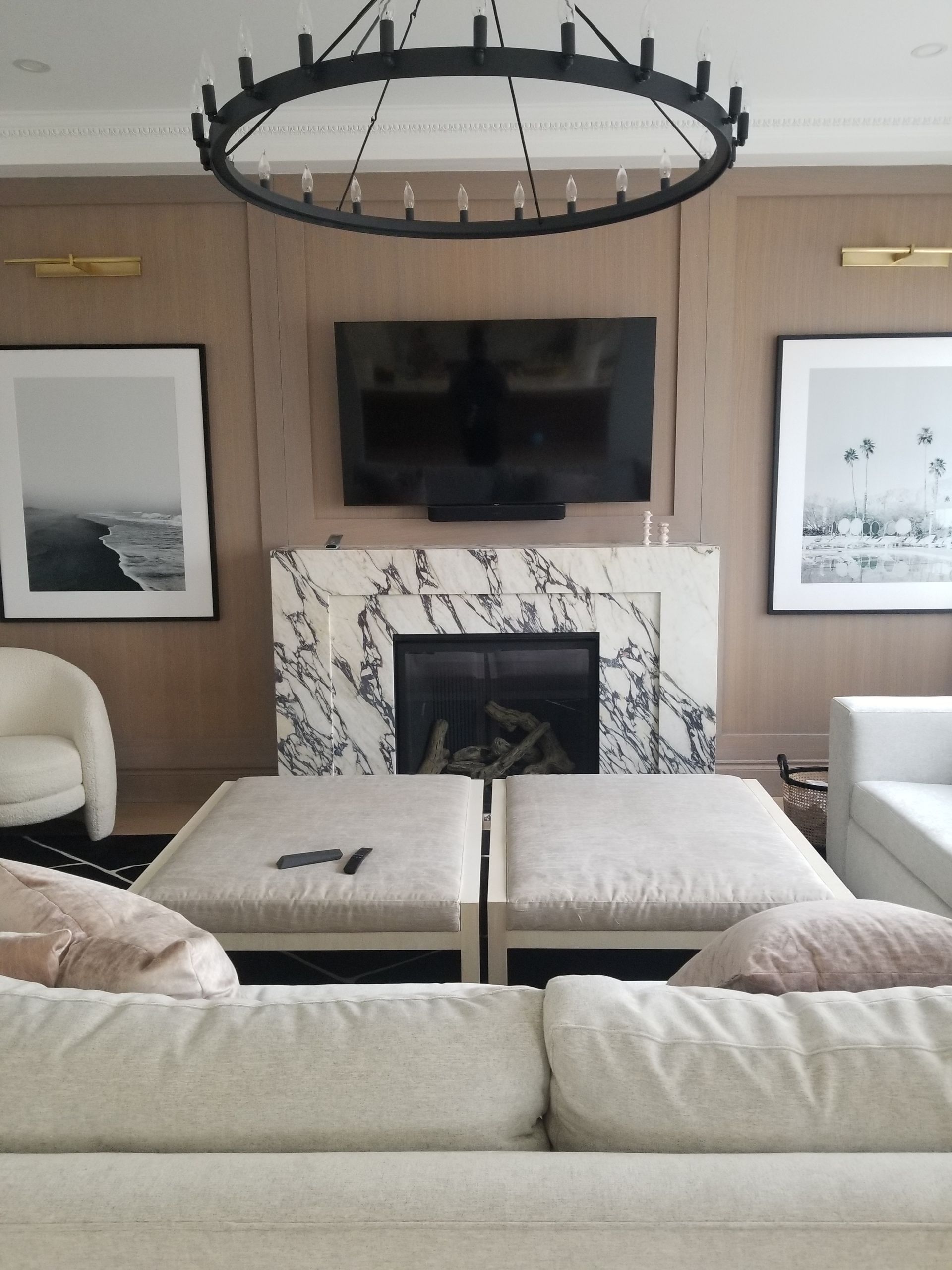 A living room with a fireplace and a flat screen tv