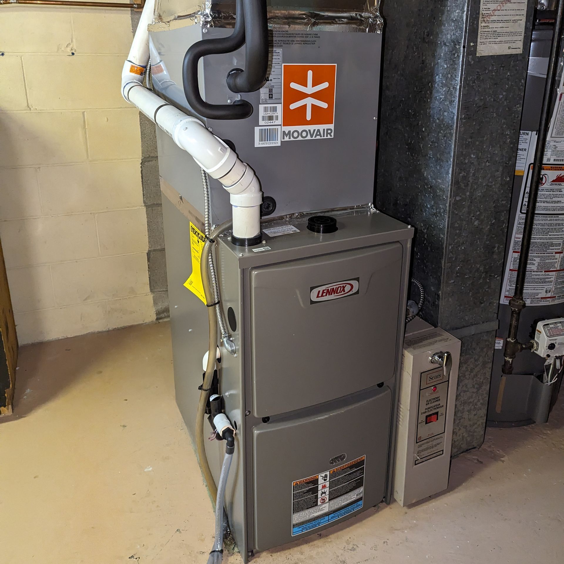 a gray furnace with an orange x on it