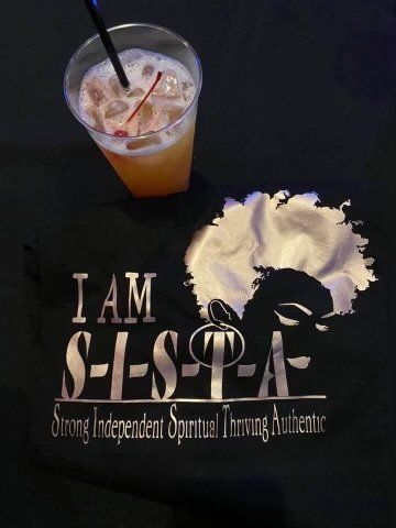 A black shirt that says i am s-i-s-p-a