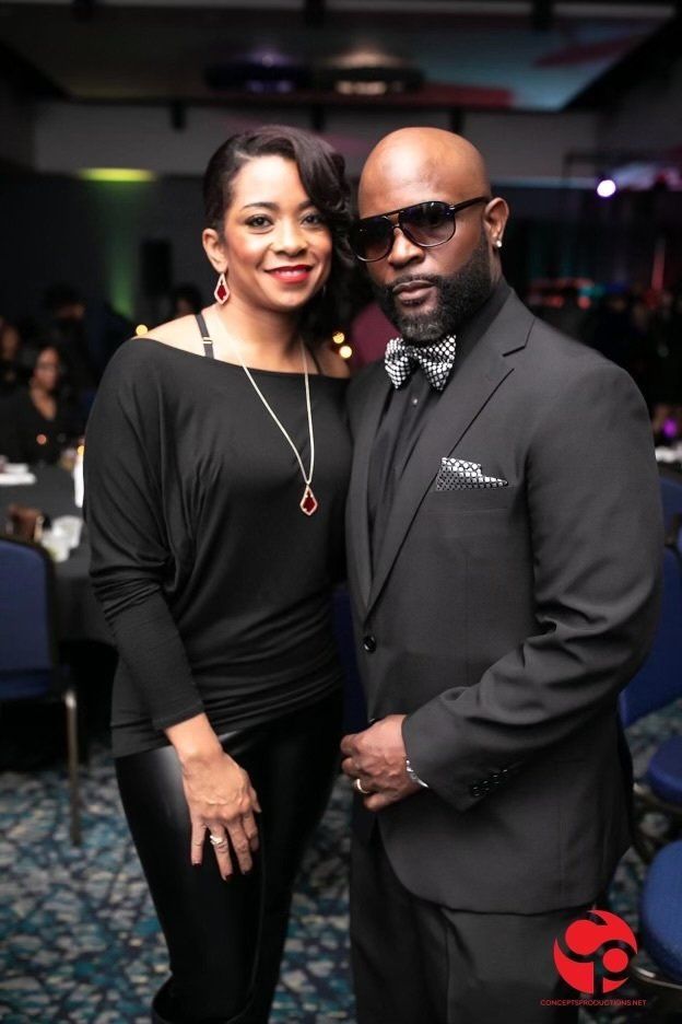 A man and a woman are posing for a picture together