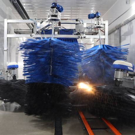 Large Vehicle Wash Equipment. Truck being washed in vehicle wash.