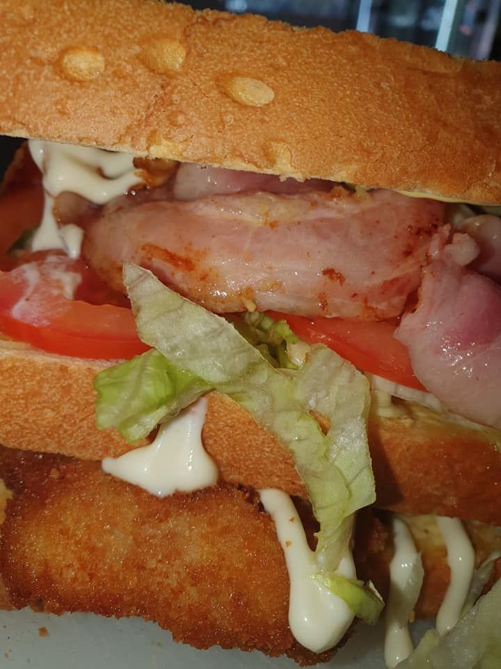 Sub Sandwich Layered with Fried Food, Bacon, Tomato, Lettuce and Mayonnaise — Mount Louisa Snack Bar in Mount Louisa, QLD