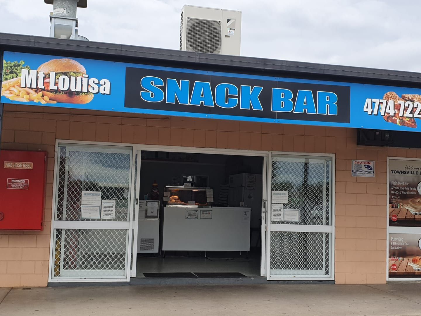 Mt. Louisa Snack Bar Exterior with Blue Sign — Mount Louisa Snack Bar in Mount Louisa, QLD