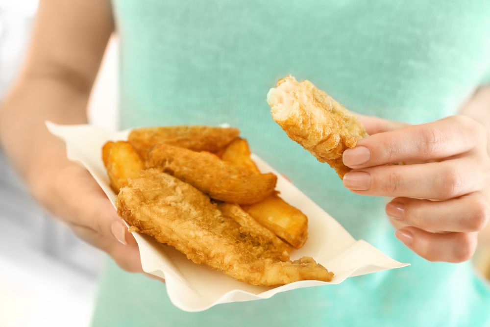 People Dining at A Restaurant, Enjoying Various Dishes and Champagne — Mount Louisa Snack Bar in Mount Louisa, QLD