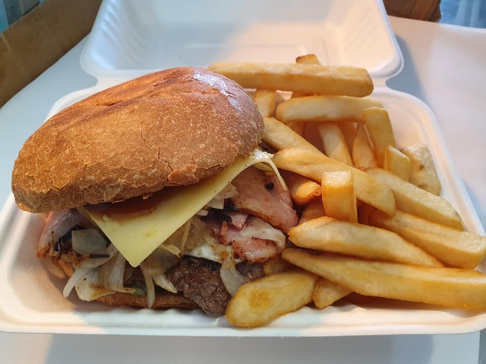 Burger with Fries in A White Foam Container — Mount Louisa Snack Bar in Mount Louisa, QLD