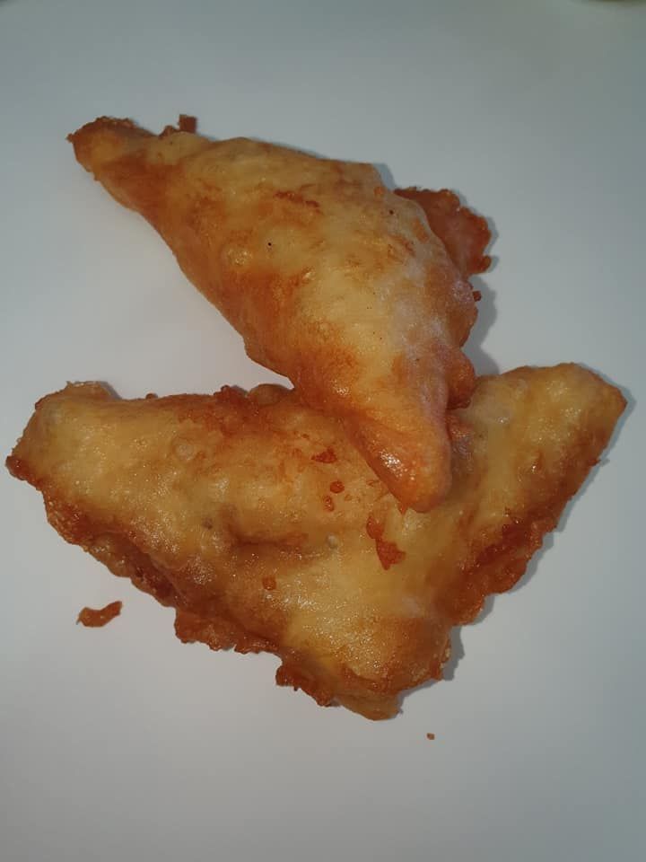 Two Pieces of Golden-Fried Fish, Overlapping on A White Surface — Mount Louisa Snack Bar in Mount Louisa, QLD