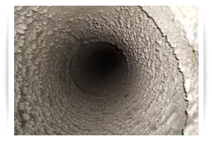 A close up of a dirty duct with a hole in the middle. A close up of a dirty duct with a hole in the middle.