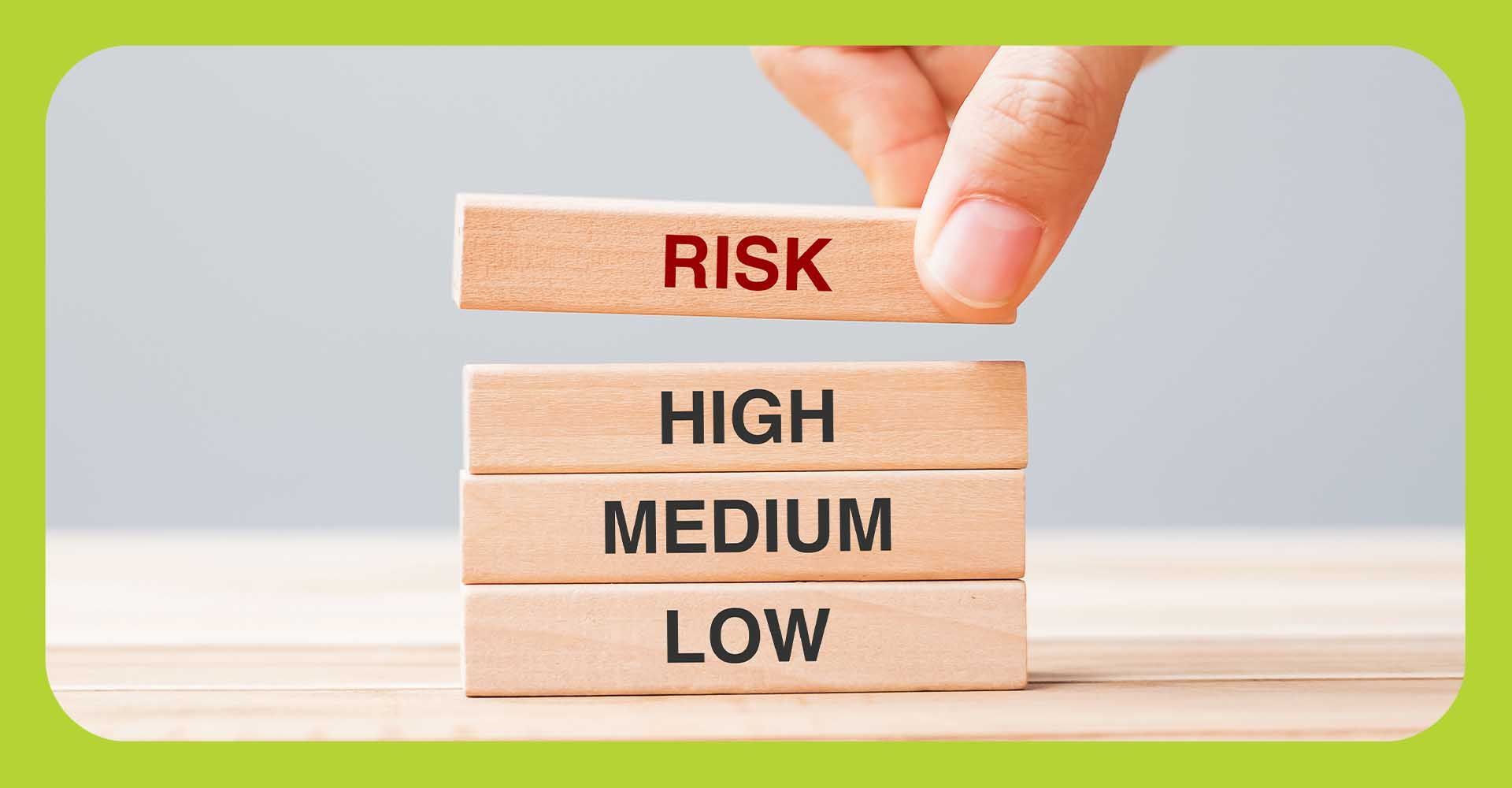Blocks being stacked that say Low Medium High Risk