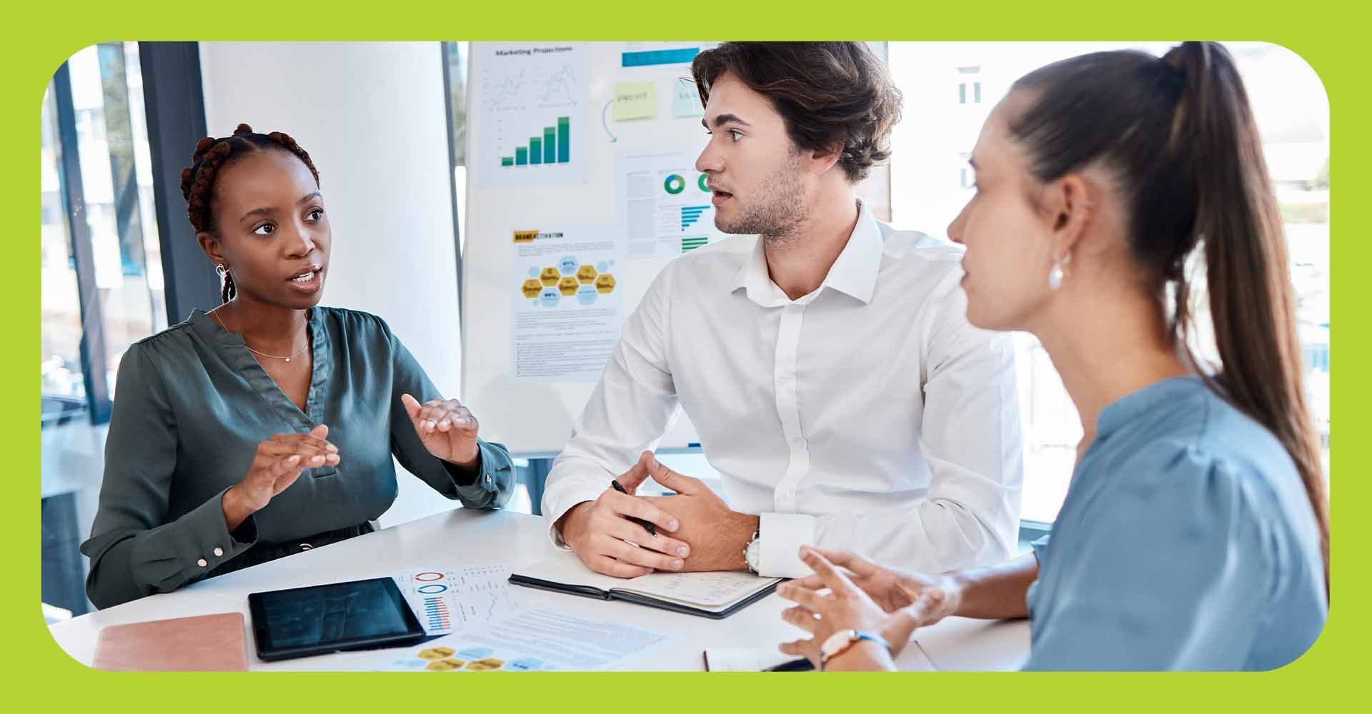 A group of business colleagues in discussion at work