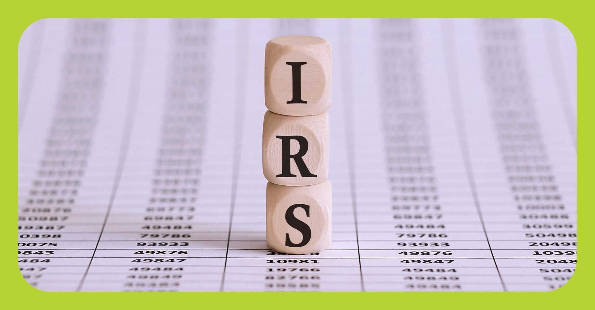 Wooden blocks stacked spelling IRS