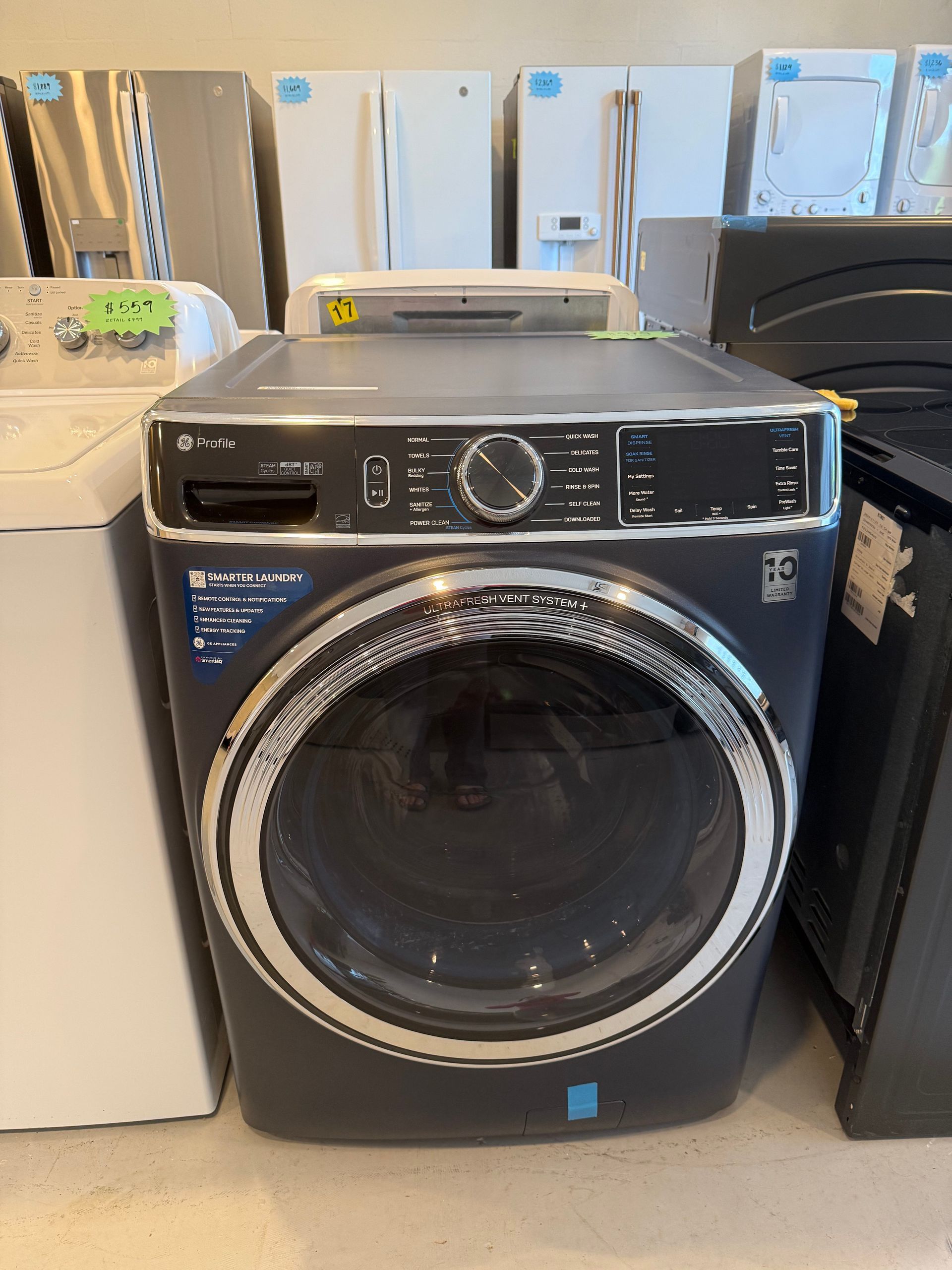 A washer and dryer are sitting on top of each other in a room.