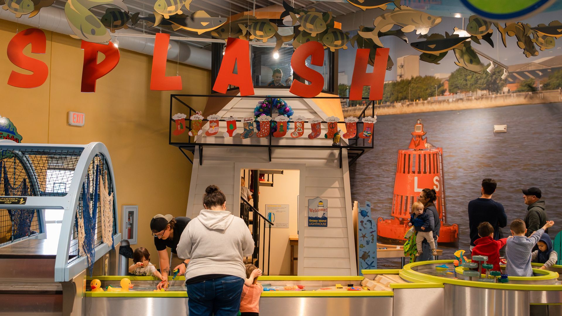 Children playing at a museum exhibit labeled 