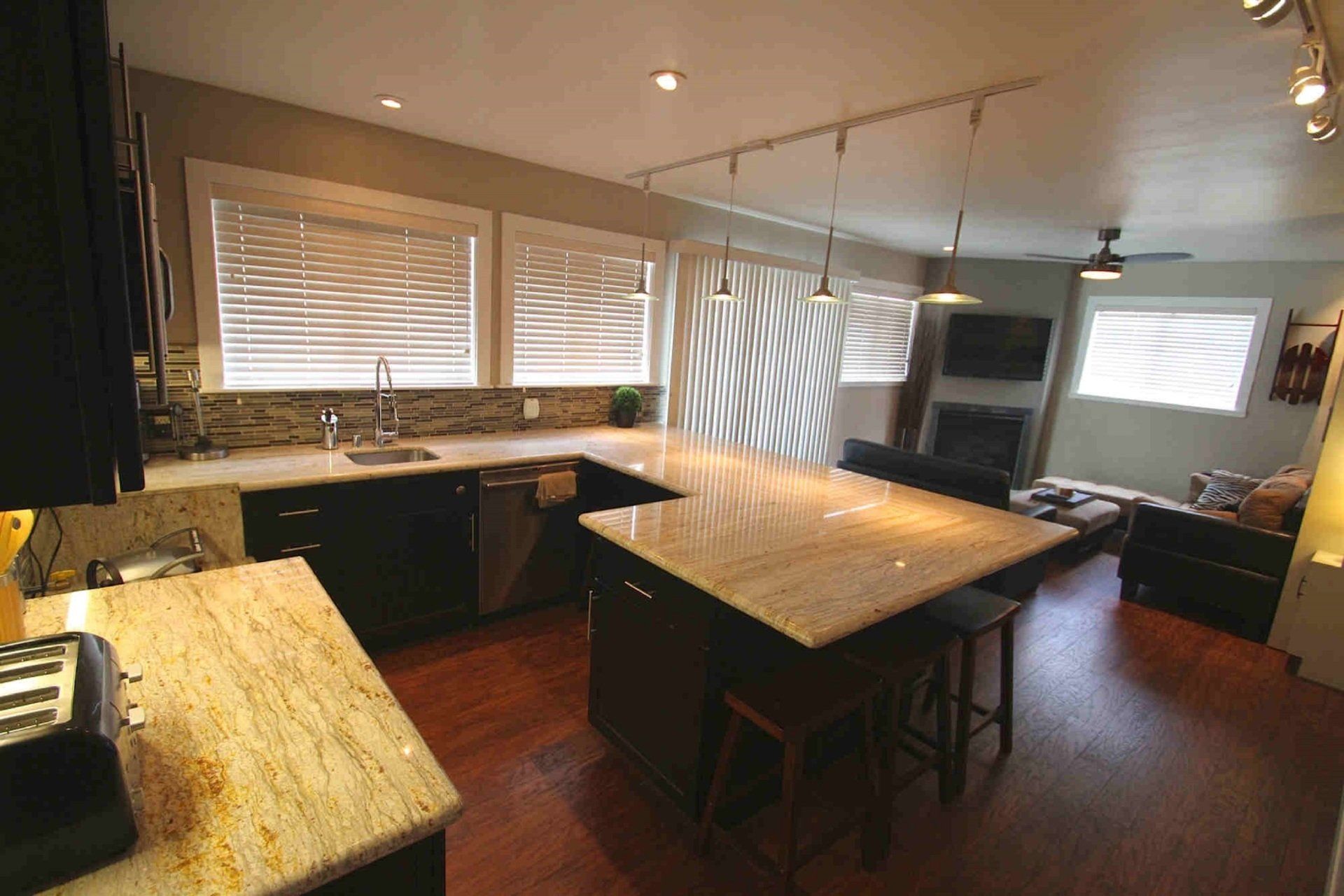 A kitchen with a large island in the middle of it
