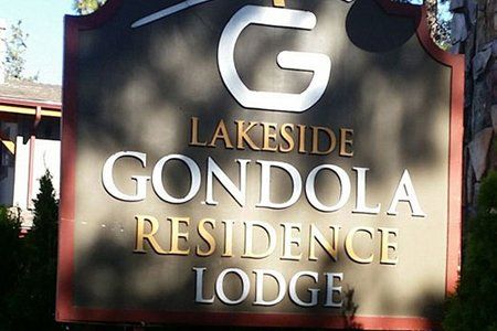 A sign for the lakeside gondola residence lodge