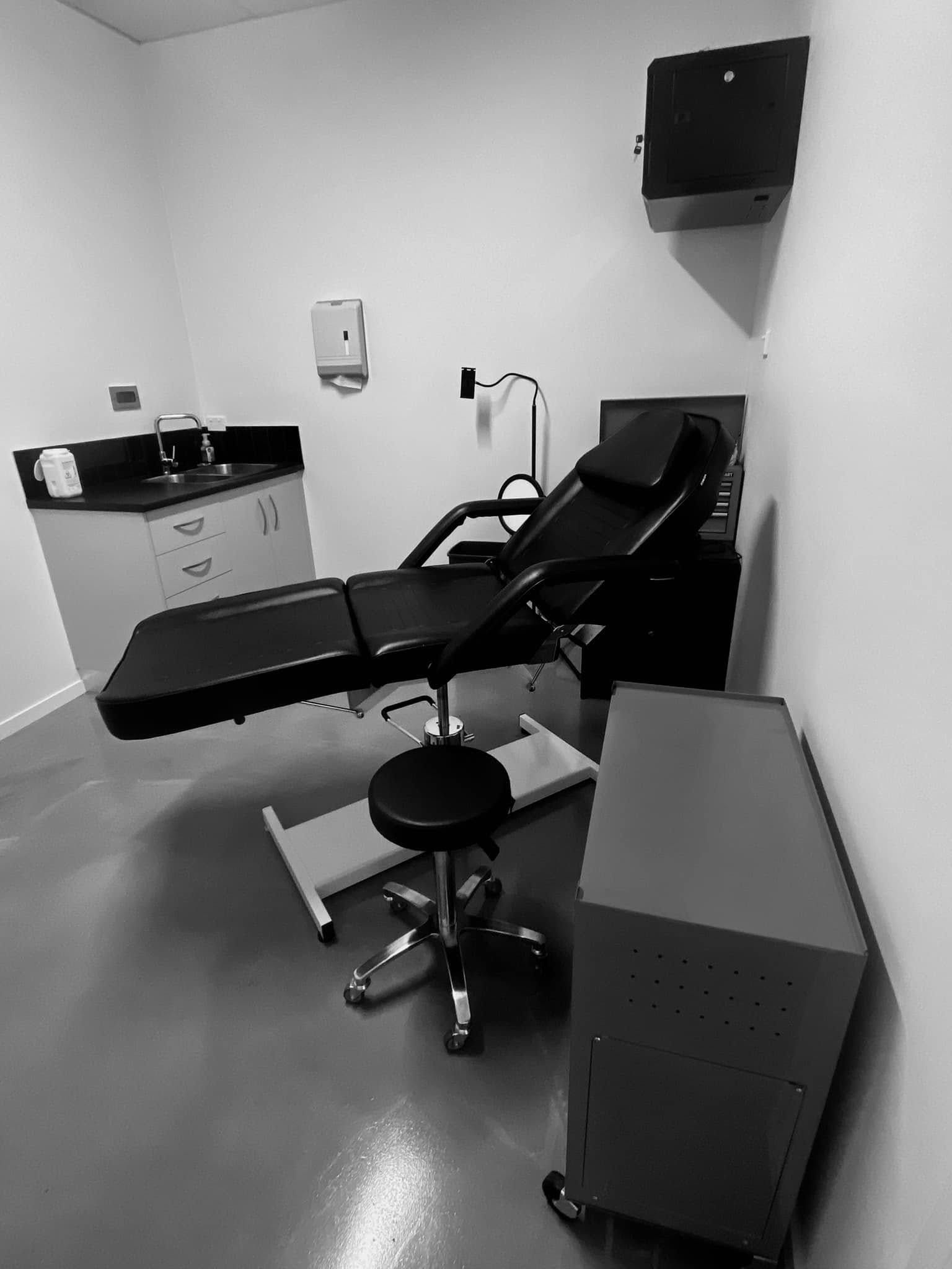A Tattoo Studio in a Black in White Colour — Pins and Needles Tattoo in Kewarra Beach, QLD