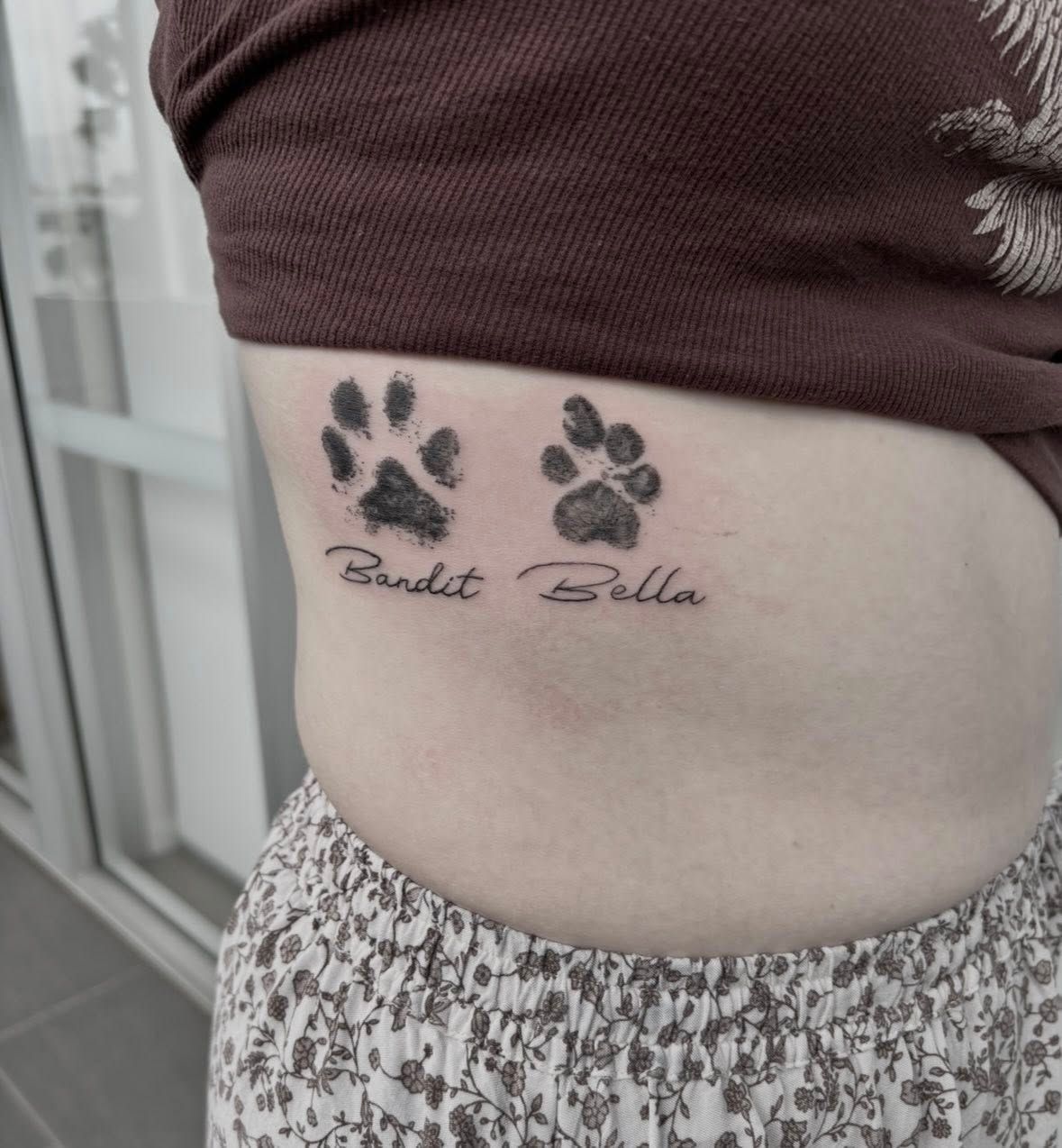Tattoo of Two Paw Prints and Names — Pins and Needles Tattoo in Smithfield, QLD
 