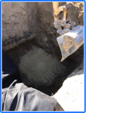 An excavator is digging a hole in the ground
