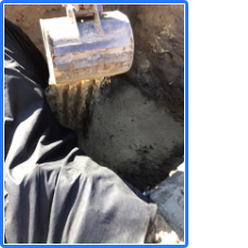 A person is digging a hole with a shovel