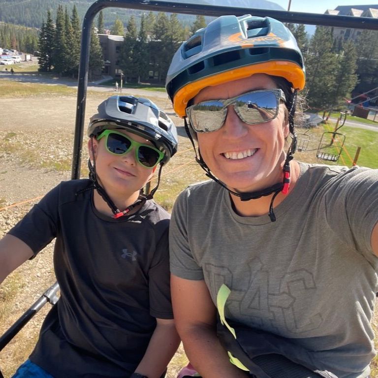 Woman and son with helmets on