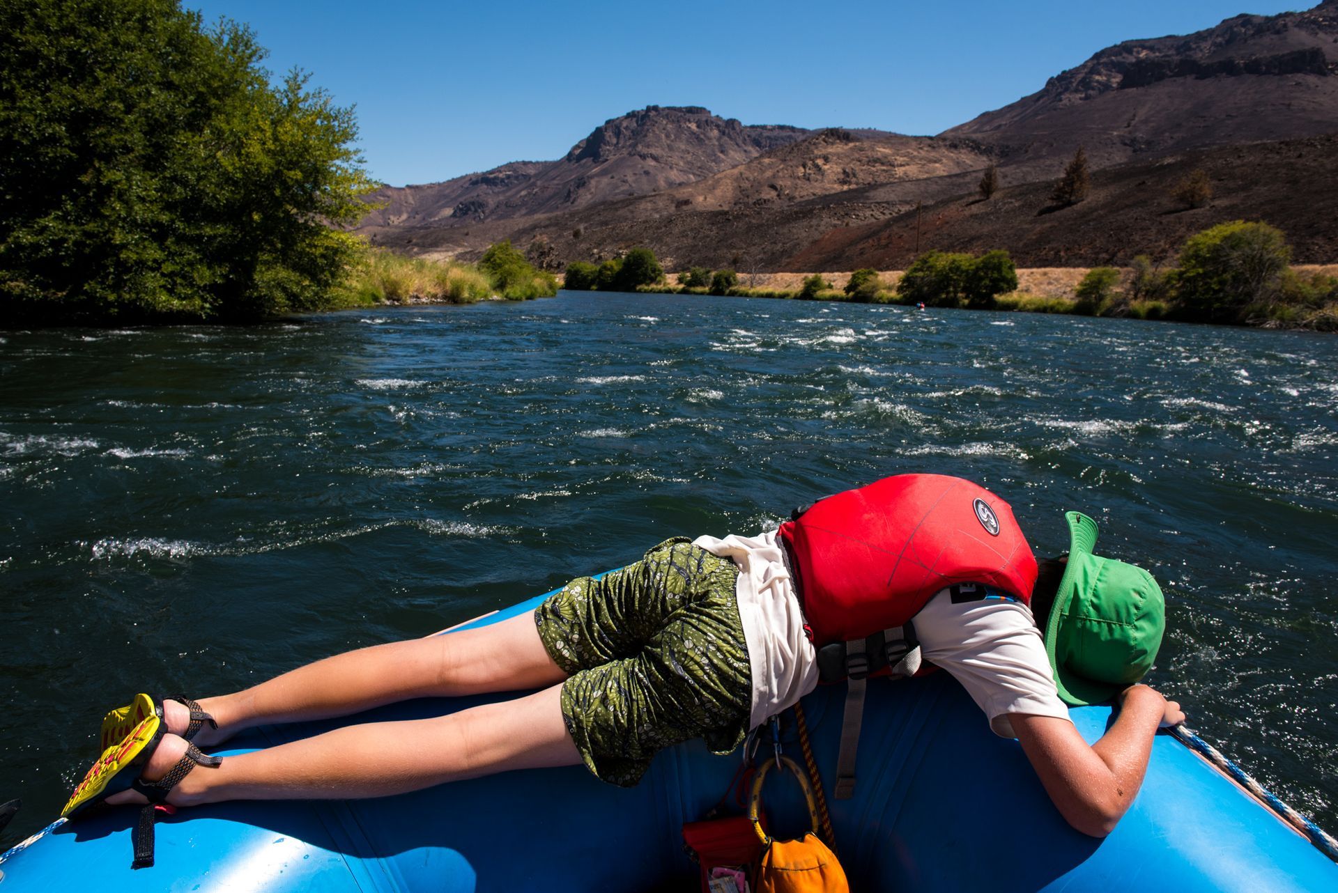 relaxing between rapids river rafting