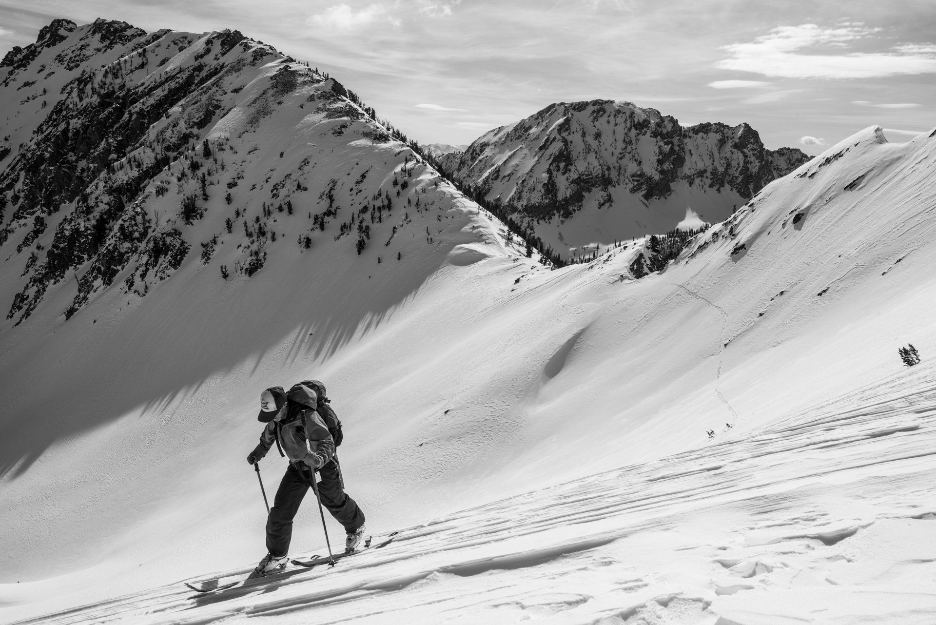 Backcountry travel in mountain terrain.