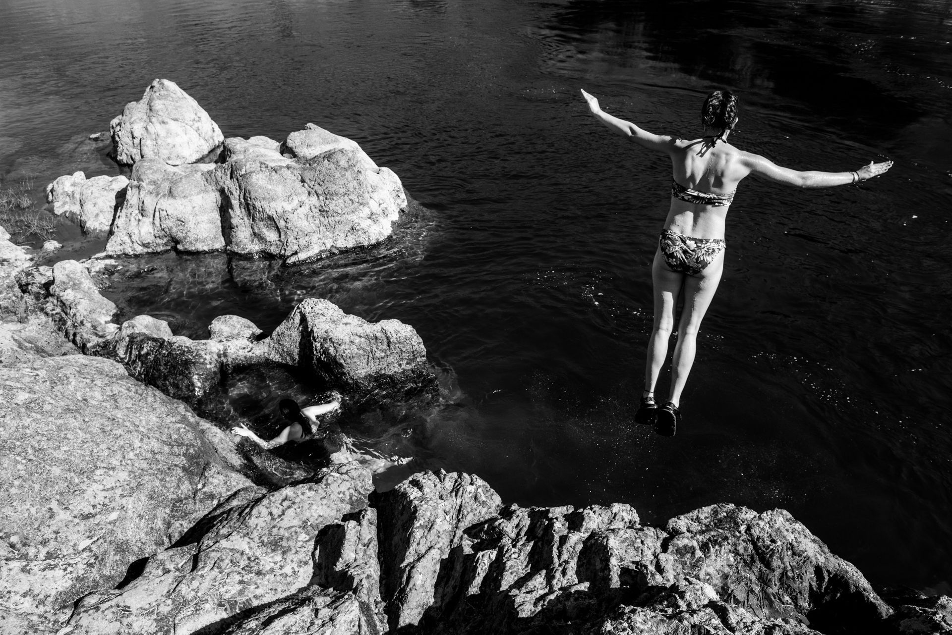 cliff jumping on raft trips is always an enjoyable time.