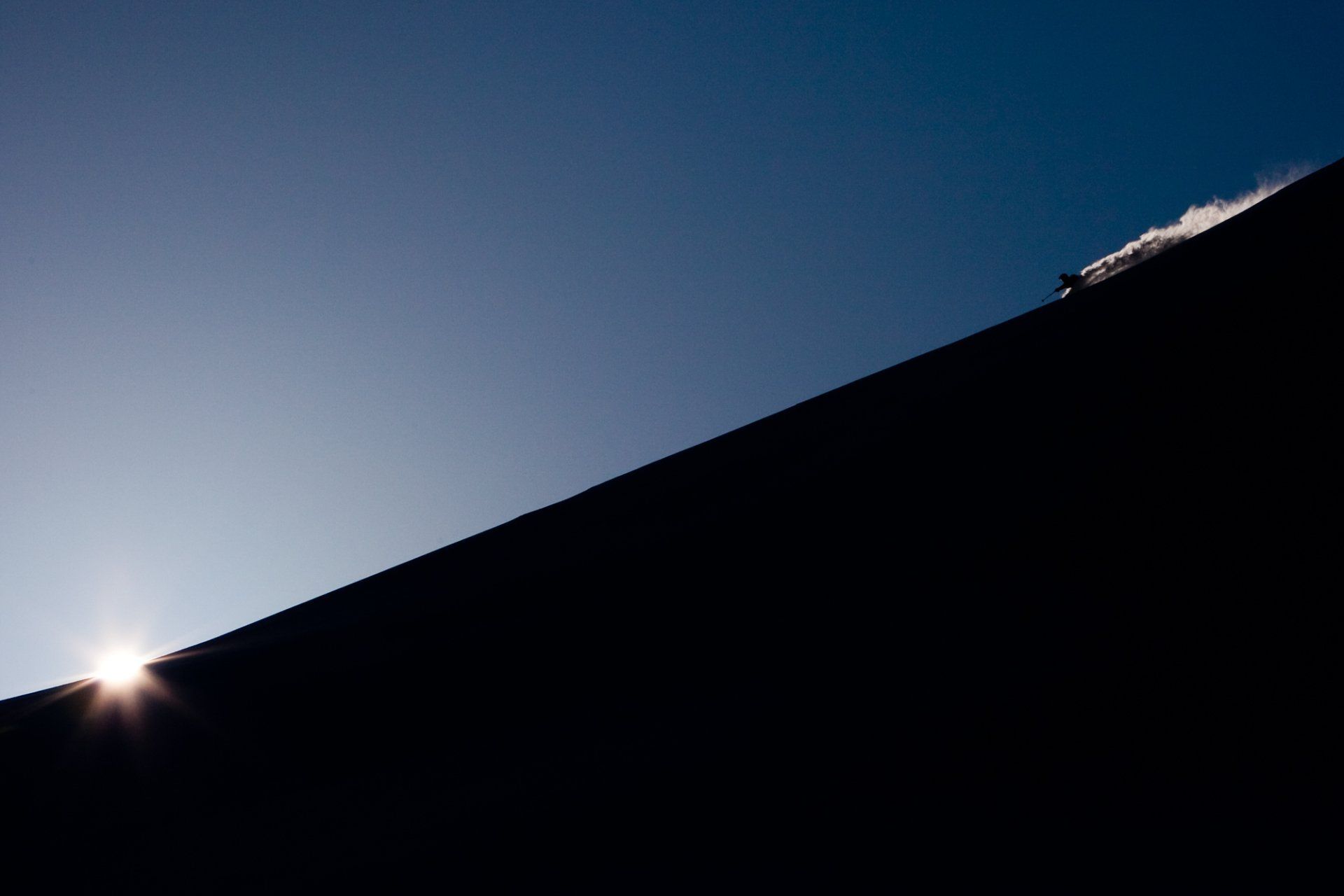 Backcountry skiing at sunrise. This image appeared in Powder Magazine.