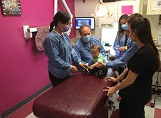 Dentists Around The Baby — Pediatric Dentist In Mcallen, TX Dentists Around The Baby — Pediatric Dentist In Mcallen, TX